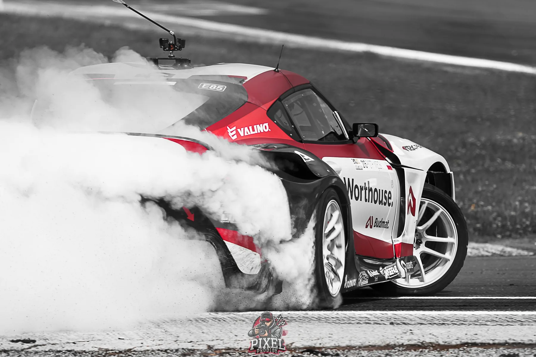 Drift Masters car surrounded by tyre smoke